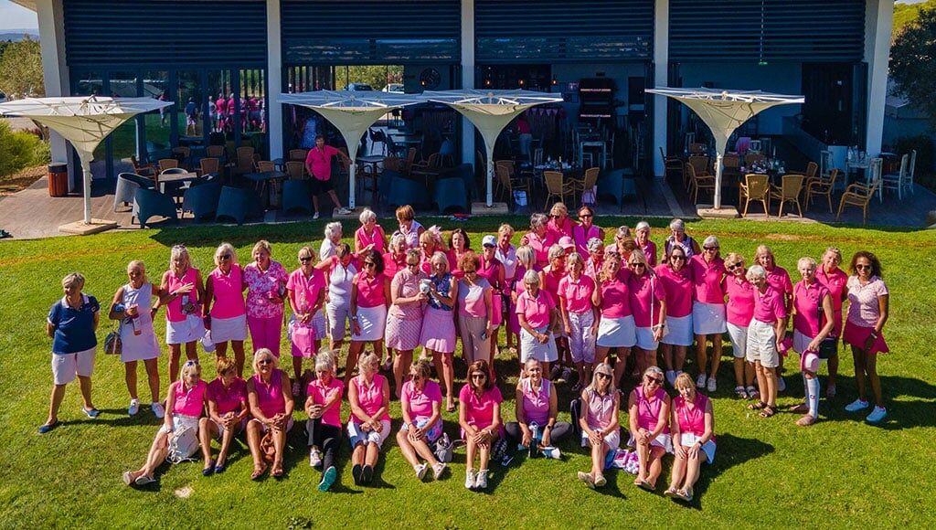 Pink Ladies gather outside clubhouse for a souvenir group photo